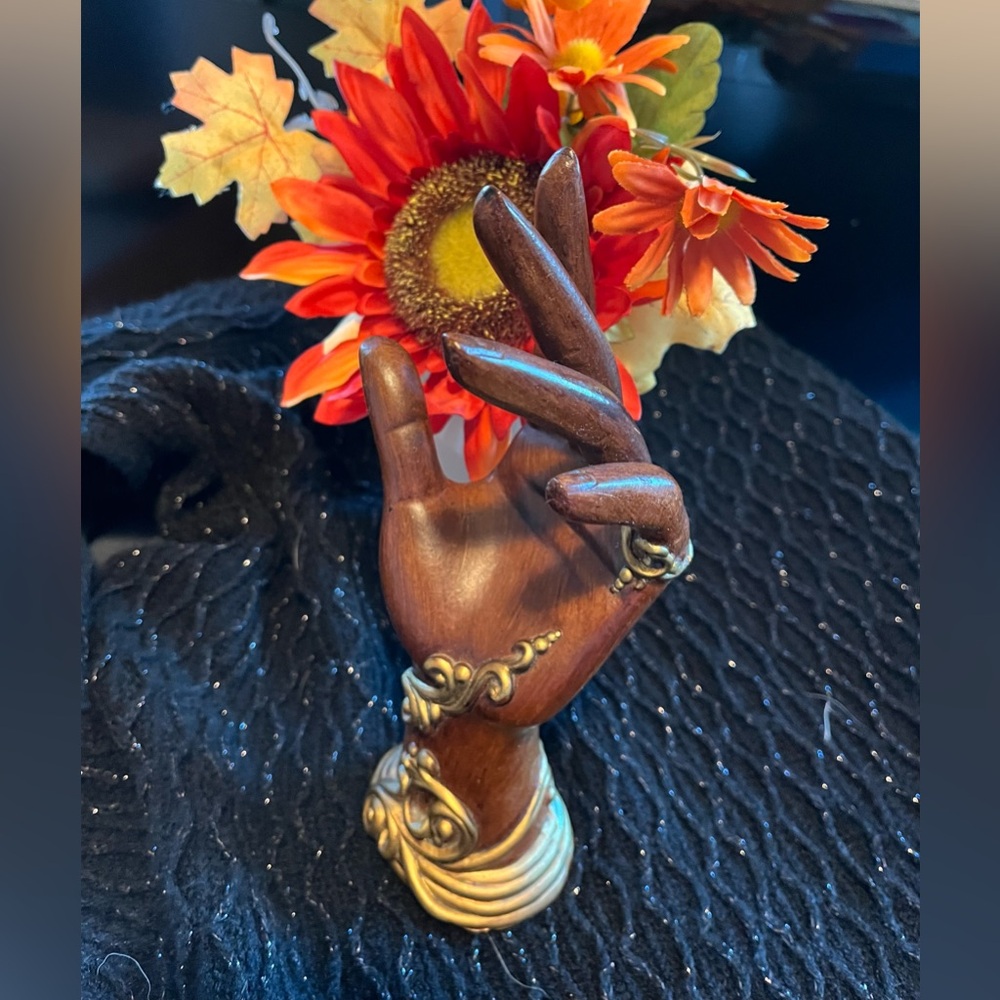 Wooden Hand Sculpture with Gold Accents 
For necklaces or bracelets